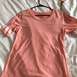 Pink and white T-shirt with strips on the sleeves